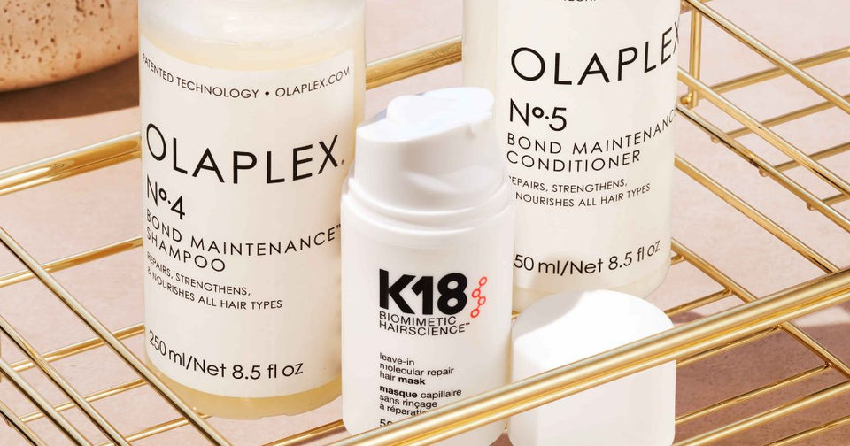 K18 Leave-In Molecular Repair Mask and Olaplex No.3 Hair Perfector side by side — bond builder comparison at Zennkai Vancouver