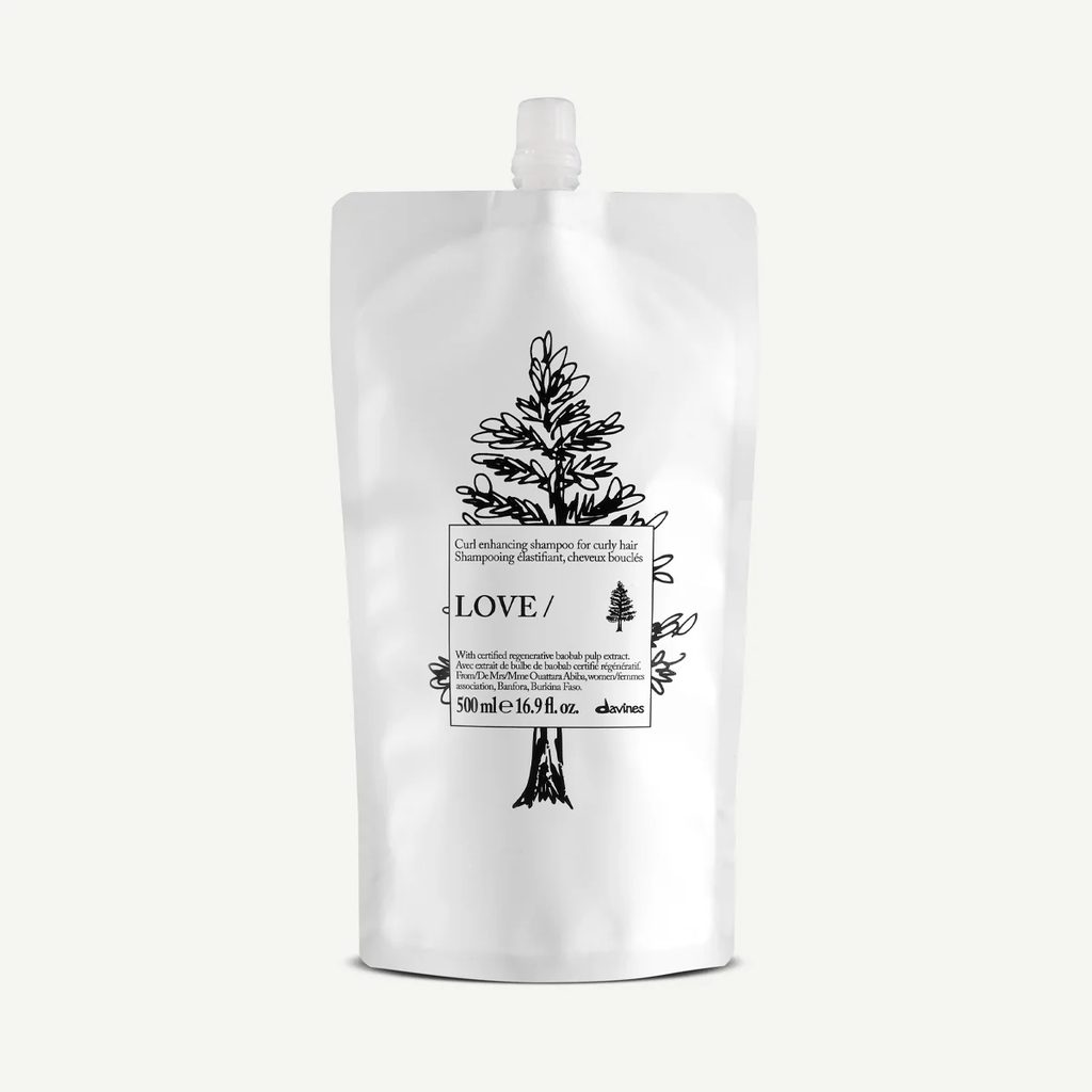 A white stand-up pouch of chilestone LOVE High Hair Shampoo with a black tree illustration and text, set against a solid off-white background.