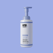 K18 TripleBright Oxidation Defense Purple Shampoo foam pump bottle on white background