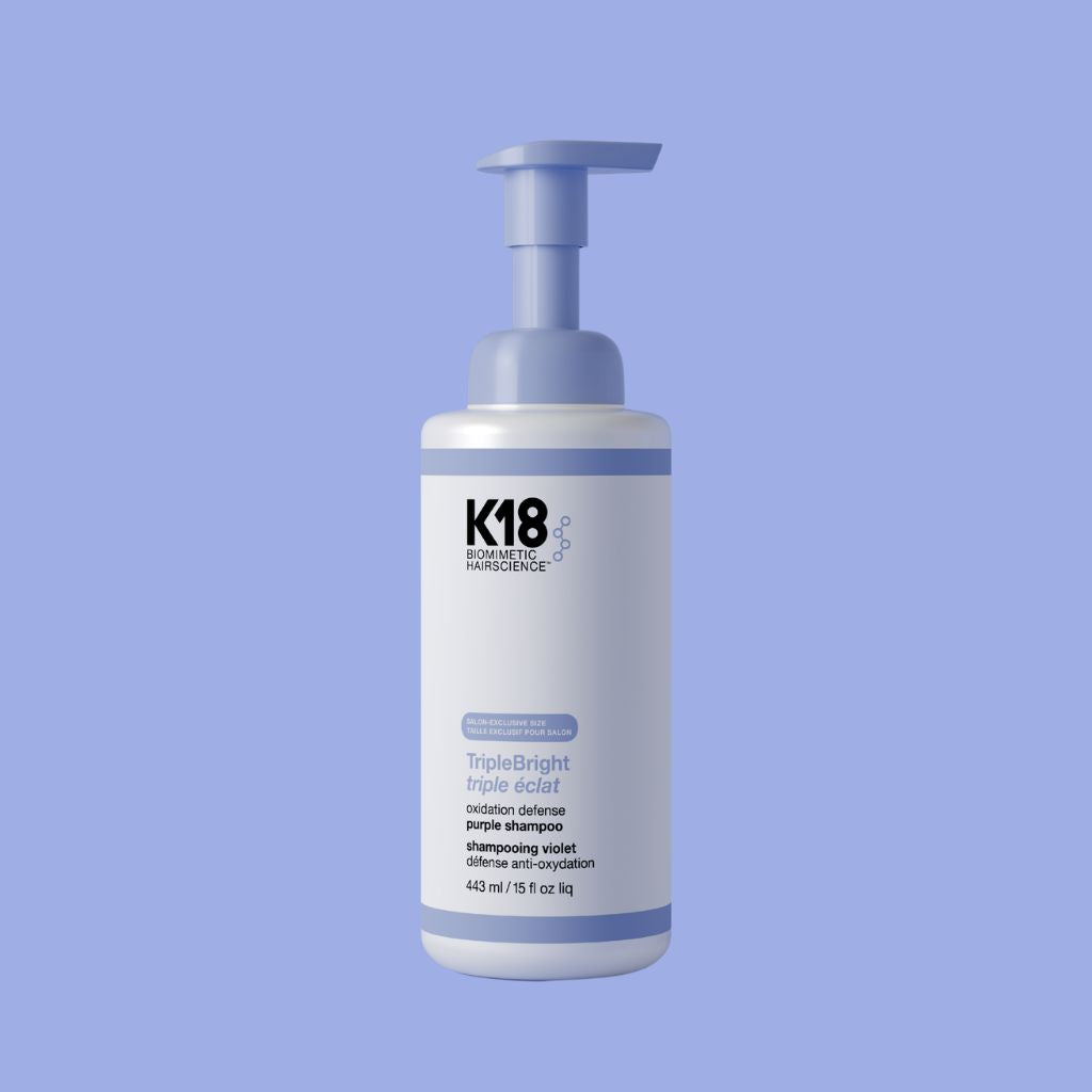K18 TripleBright Oxidation Defense Purple Shampoo foam pump bottle on white background