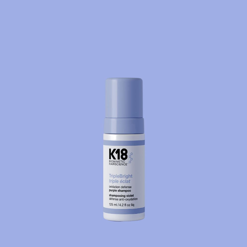K18 TripleBright Oxidation Defense Purple Shampoo foam pump bottle on white background