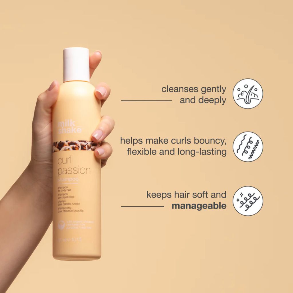 Woman with defined, frizz-free curls using the milk_shake Curl Passion 1L duo set